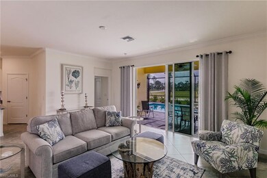 Relax in the living area with a view of the pool a