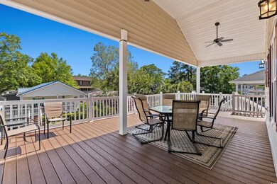 Wooden terrace featuring ceiling fan