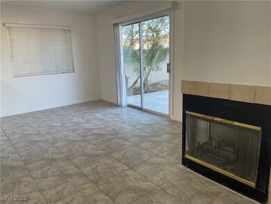 Unfurnished living room featuring baseboards