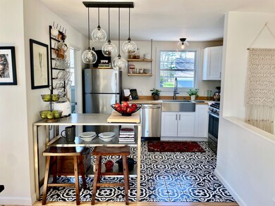 A well appointed kitchen with stainless steel island