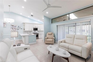 Living area featuring a ceiling fan, baseboards, recessed lighting, high vaulted ceiling, and light tile patterned floors