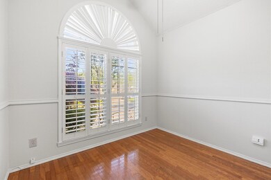 Empty room featuring wood finished floors, baseboa