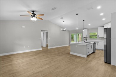Please step inside and enjoy the tour! Picture taken just inside the front door of the huge open concept entertaining area with vaulted ceiling.