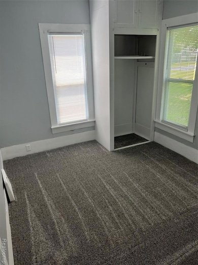 First floor bedroom with new windows, blinds and carpet,