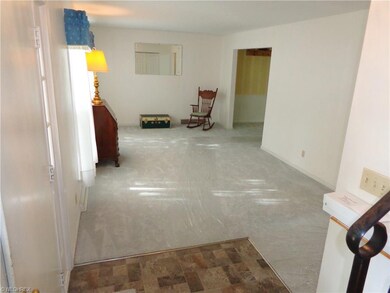 New neutral grey/taupe carpet throughout the house