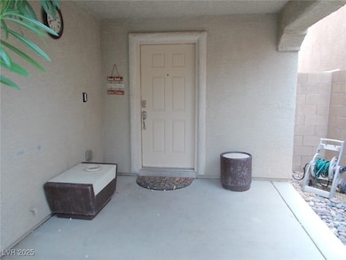 View of exterior entry featuring stucco siding