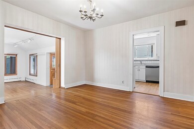 Dining room looking into kitchen and family room