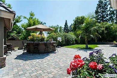Nearby a large BBQ with refrigerator and warming d