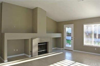 Living room with cozy fireplace, ceiling fan and c