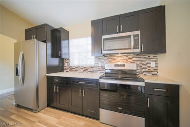 The Kitchen Has Granite Countertops, Tile Backspla