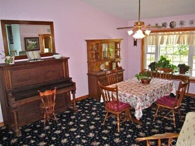 Formal dining room overlooks the backyard.