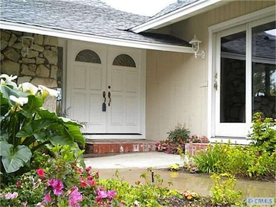 Entry court with lush landscaping.
