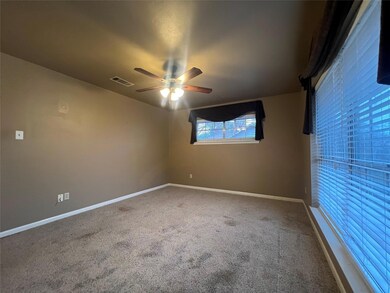Bedroom #1 with ceiling fan and carpet floors