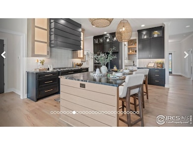 Kitchen w/large island.  Actual photo of previous build by sister company in another state.