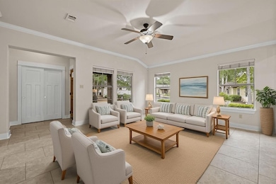 Virtually staged living room full of natural light looking toward the foyer and front of home.