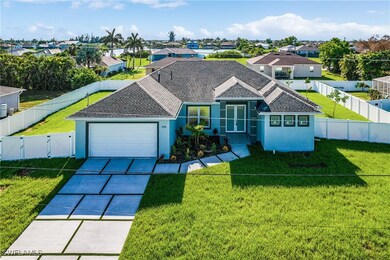 View of front of home featuring driveway, an attac