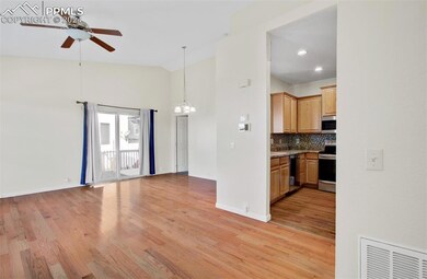 Living room with high vaulted ceiling, tasteful ba