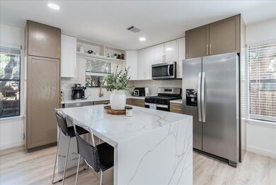Kitchen with backsplash, open shelves, stainless 
