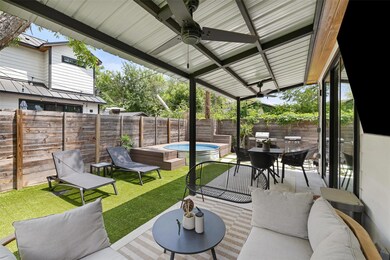 View of patio with ceiling fan, a hot tub, outdoo