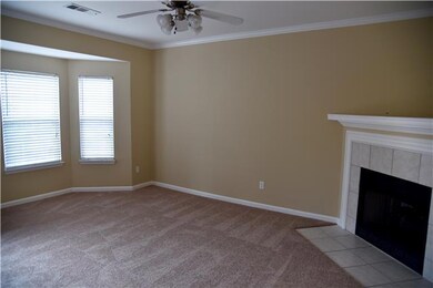 All new paint and carpet.  Bay window, ceiling fan and corner gas fireplace.
