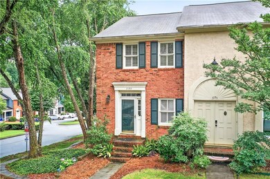 View of front of house with stucco siding and brick siding