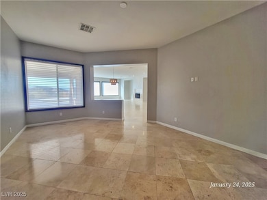 Unfurnished room with baseboards and visible vents