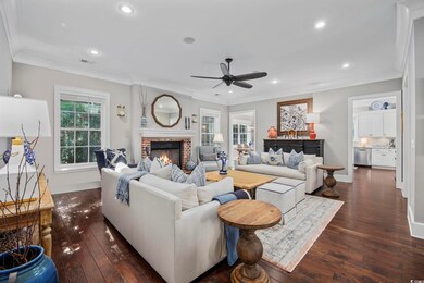 Living room with dark hardwood / wood-style floori
