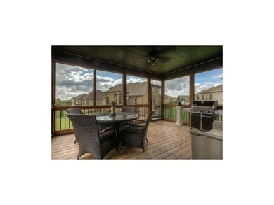 Large covered screened-in deck with ceiling fan an