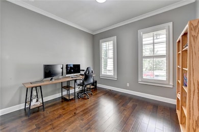 Office space with ornamental molding, wood-type fl