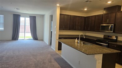 Kitchen featuring stainless steel appliances, dark