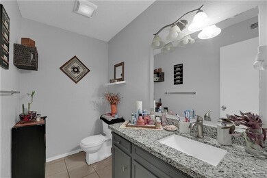 Bathroom with tile floors, toilet, and vanity