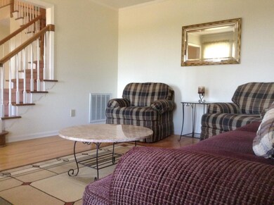 To the right of the entrance is a spacious living room. With a den near the kitchen you could also choose to use this room for an office or study.