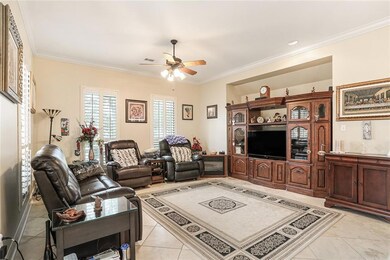 Den with Plantation Shutters, Travertine floors No