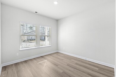 Empty room with light wood-type flooring