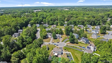 Aerial view of property and surrounding area with