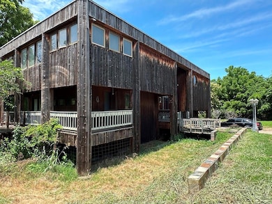 View of side of property featuring a yard