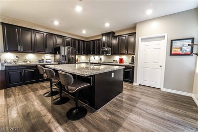 Open gourmet kitchen featuring quartz countertop,