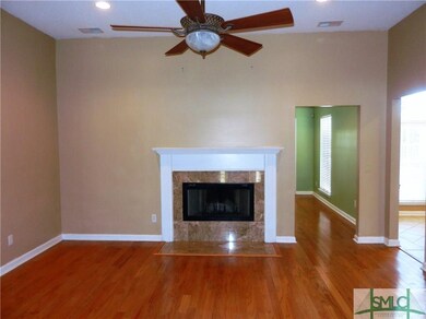 Living Room with Wood Burning Fireplace