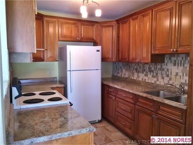 Another view of kitchen.  Custom tile work and sel