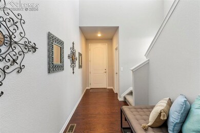 Hall featuring dark wood-type flooring