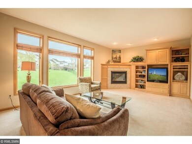 Living room with tile surround gas fireplace and c