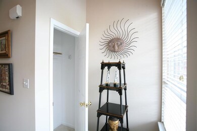 Foyer with hall coat closet.
