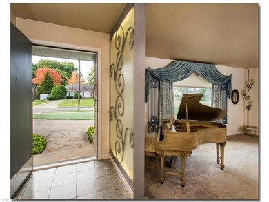 Large front door and marble floor.