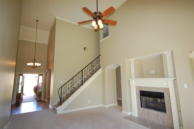 Large, open family room with fresh paint and a brand new carpet.