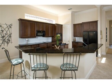 Kitchen has granite countertops, raised panel cabi