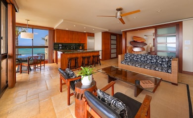 The Kuhio Shores #413 location inspired the designer's mid-century & asian surf vibe with vintage and custom-designed furnishings and a collection of Hawaiiana objet d'art. Brazilian Cherrywood shoji doors create privacy for both bedrooms and bathrooms.
