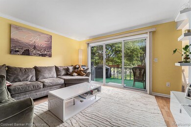 Living room and doorwall leading onto balcony