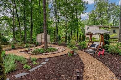 View of yard featuring view of wooded area