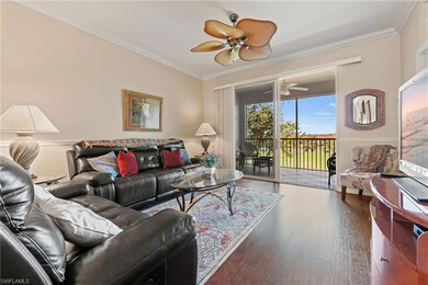 Living room with ceiling fan, dark hardwood / wood