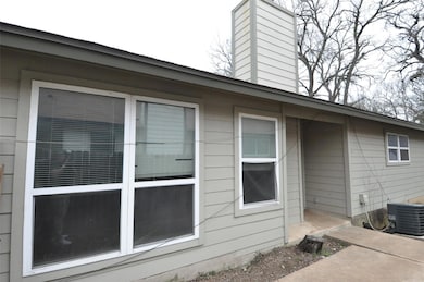View of property exterior with central air condit